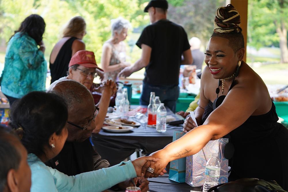 An image of Dr. Bailey greeting guests after her speech