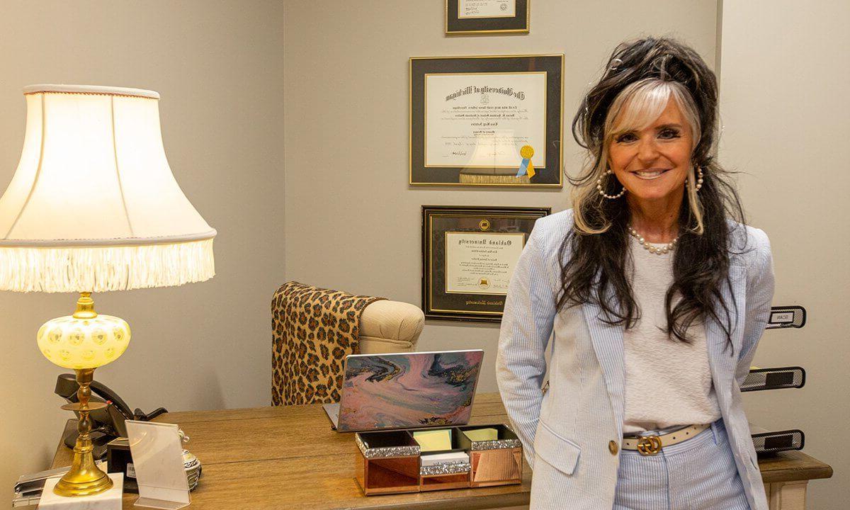 woman standing by desk